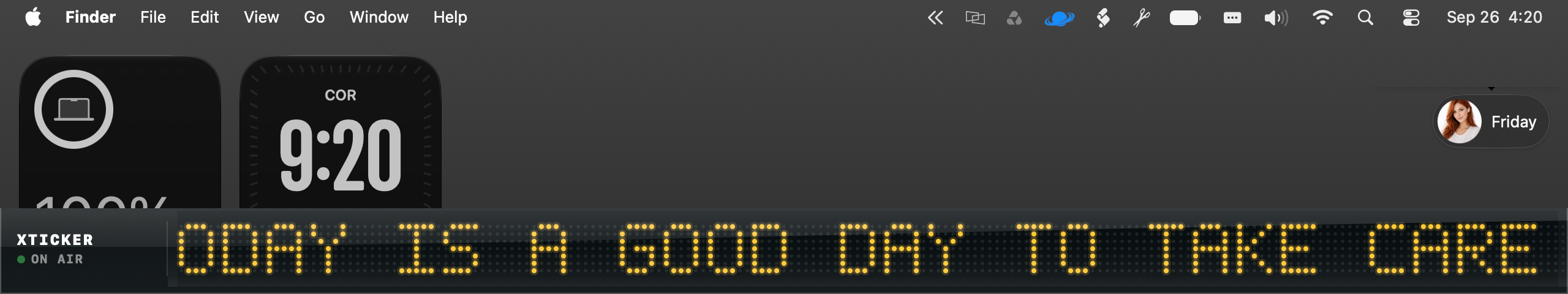 XTicker's LED matrix ticker running live above the Dock on a real Mac desktop, next to Weather and Clock widgets